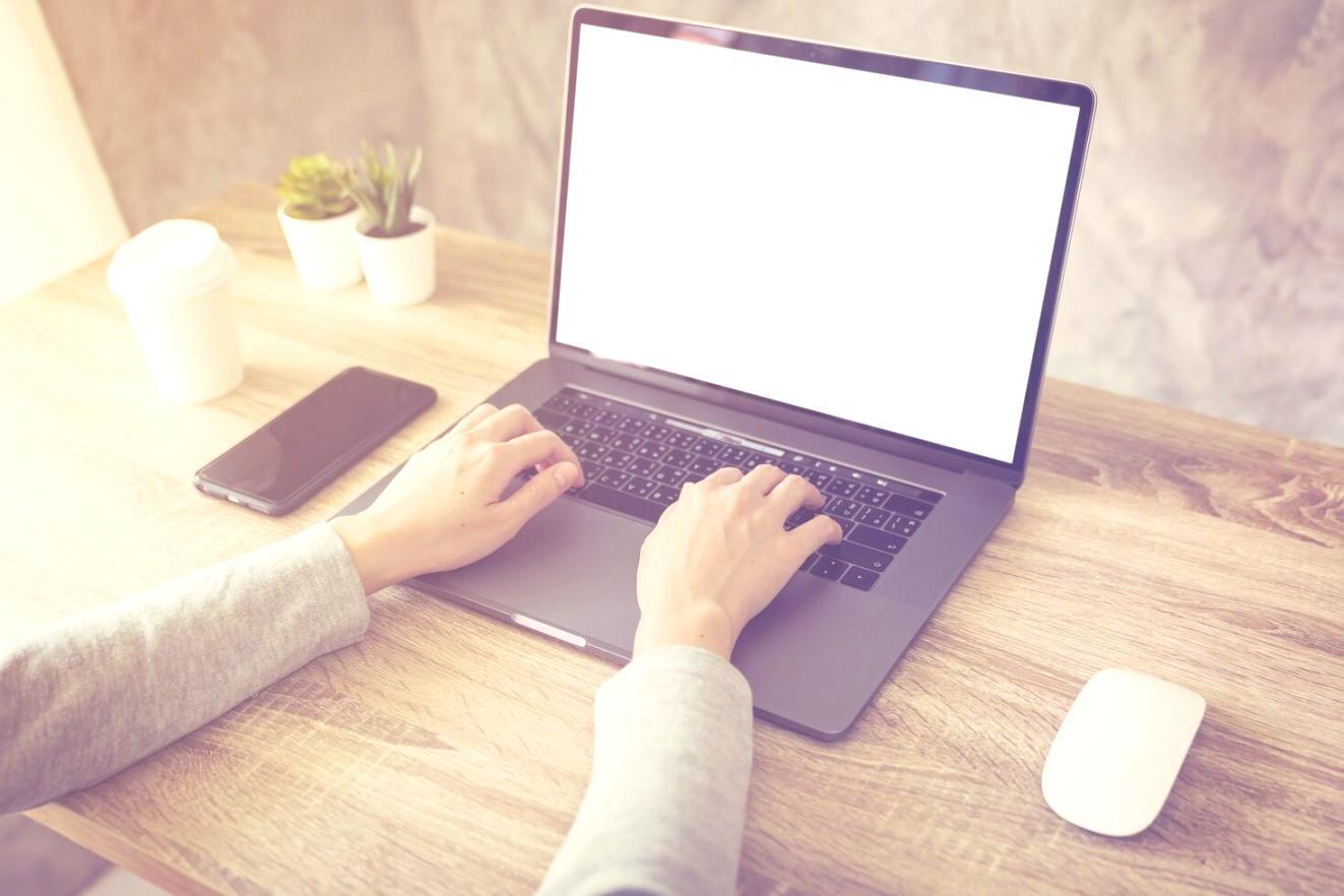 Business owner reviewing financial documents at desk